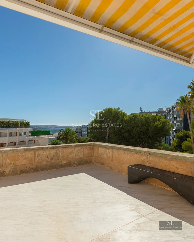 Infinity pool view with sundeck, loungers, and greenery. Modern luxurious design with panoramic views. Minimalist architecture.