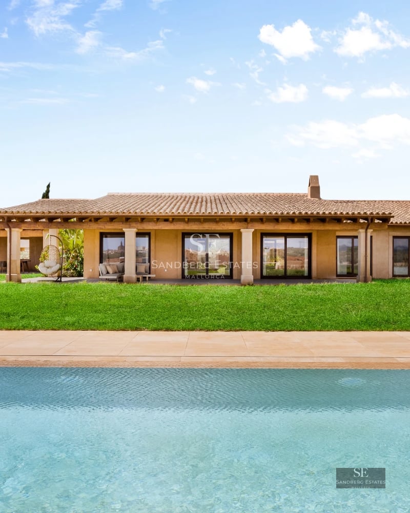 Modern pool view with sleek furniture and lush gardens. Minimalist architecture with large windows and natural lighting.