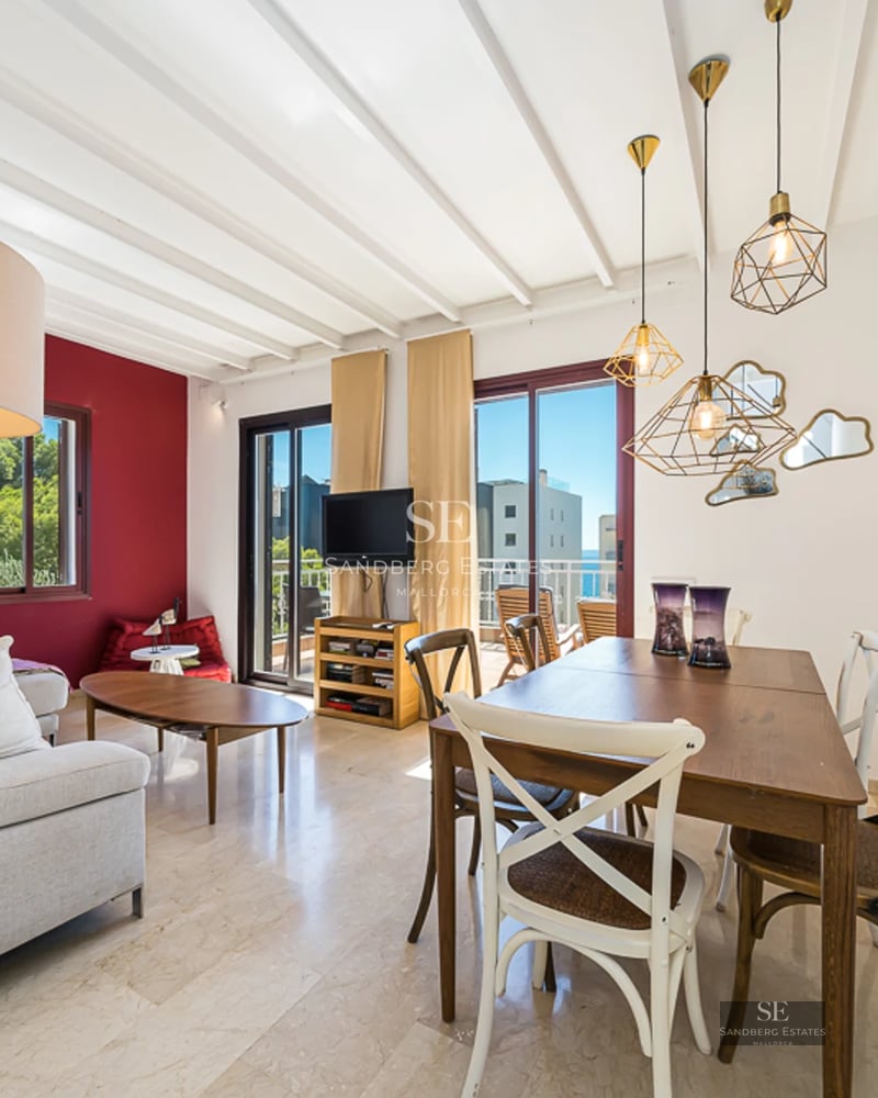 Spacious living room with balcony and panoramic sea views. Modern design, elegant furnishings and abundant natural light.