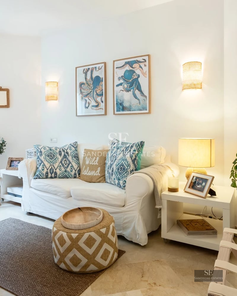 Spacious terrace with panoramic views. Modern outdoor furniture, awning, and lush greenery. Warm lighting and a relaxing atmosphere.