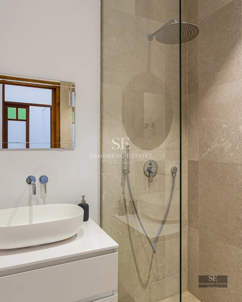 Exterior view of a luxurious pool villa featuring modern design, large windows, and manicured gardens. Ideal for families.