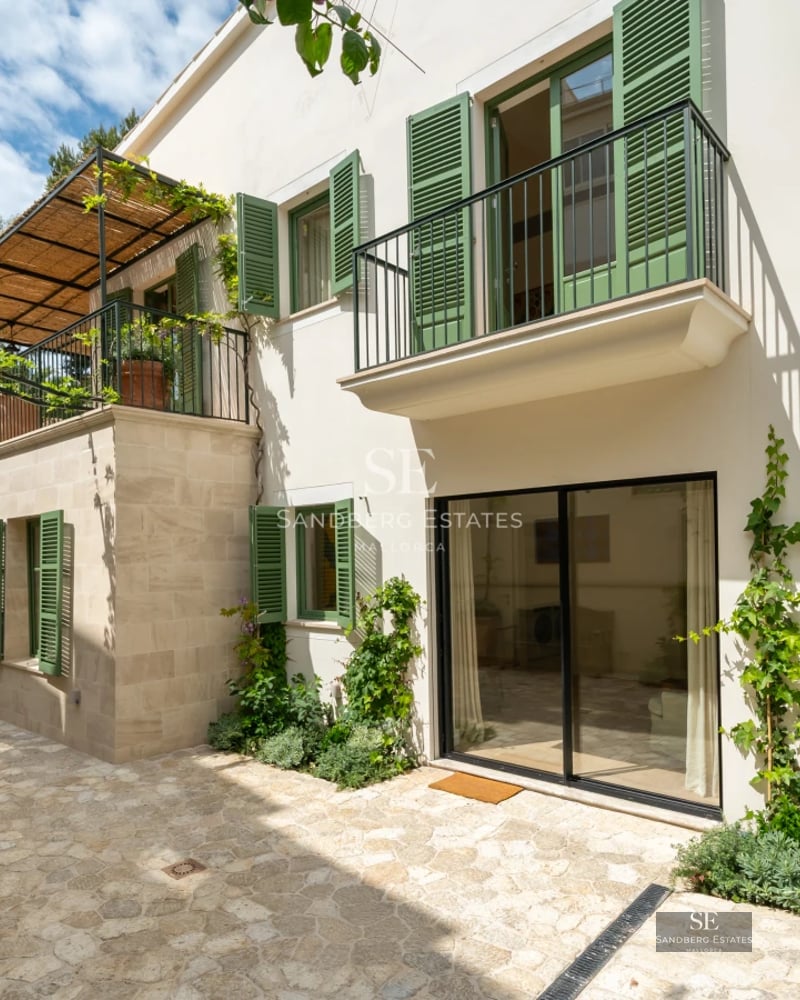 Exterior view of a modern villa with a pool, garden, and clean architectural design. Soft lighting, neutral colors, and lush landscaping.