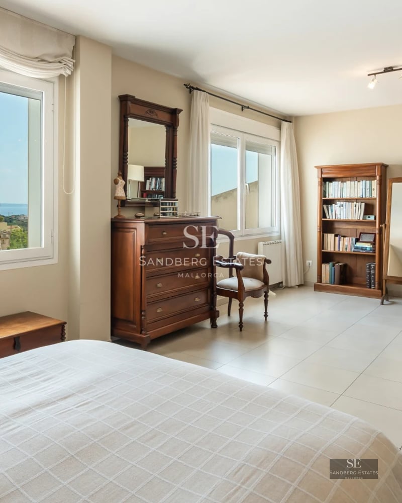 Bright interior with a balcony overlooking the sea. Modern design featuring wood floors, elegant furnishings and abundant natural light.