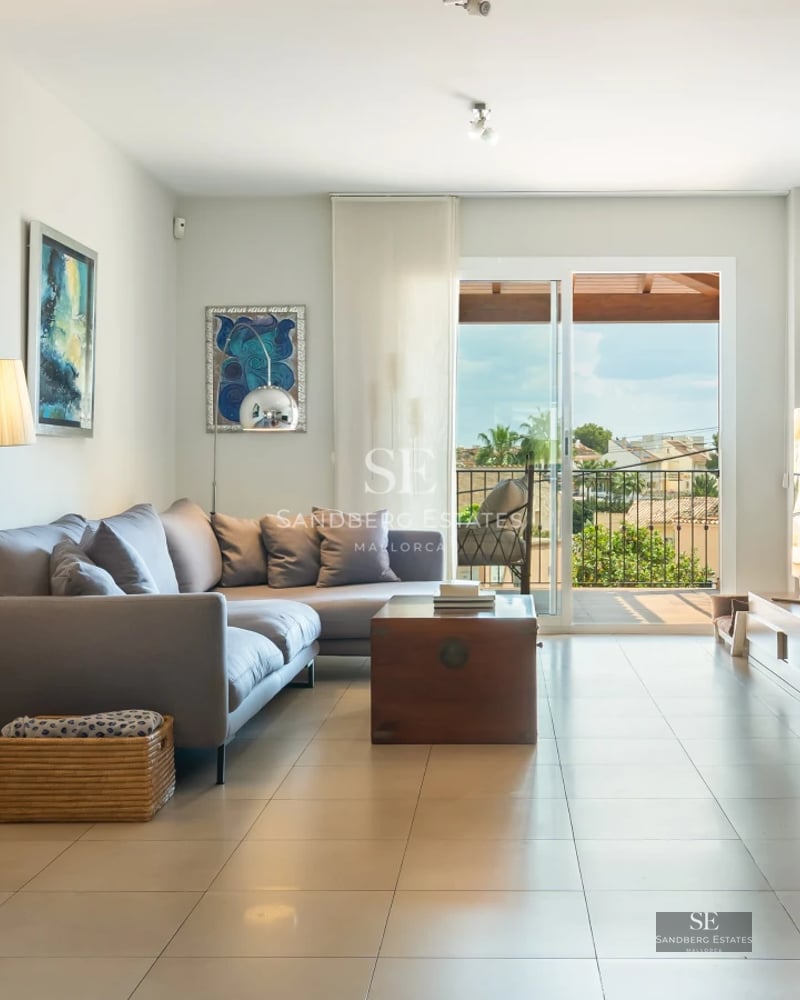 Image of an elegant swimming pool with sun loungers and lush vegetation. Modern architecture and relaxing atmosphere.