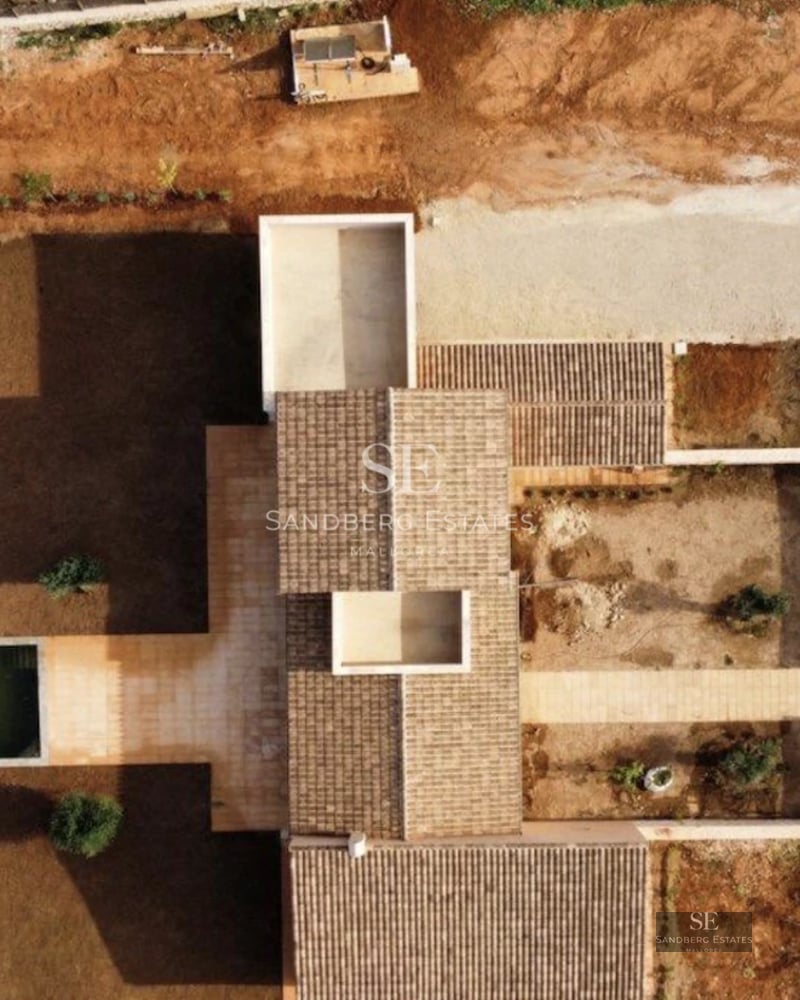 Spacious balcony with panoramic sea views. Elegant outdoor furniture, wooden flooring, and glass railing.