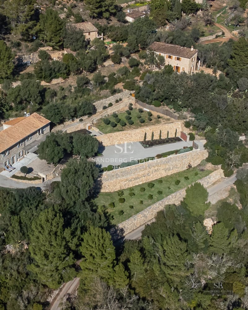 Spacious living room with large windows, balcony with sea view. Modern design, natural lighting, and wooden floors.