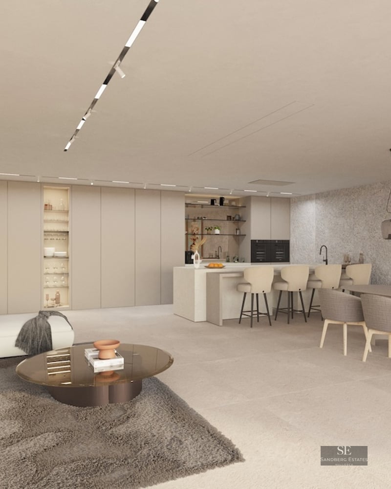 Spacious open-plan living area with white sofa, modern black fireplace, dining set, and minimalist kitchen in neutral tones.