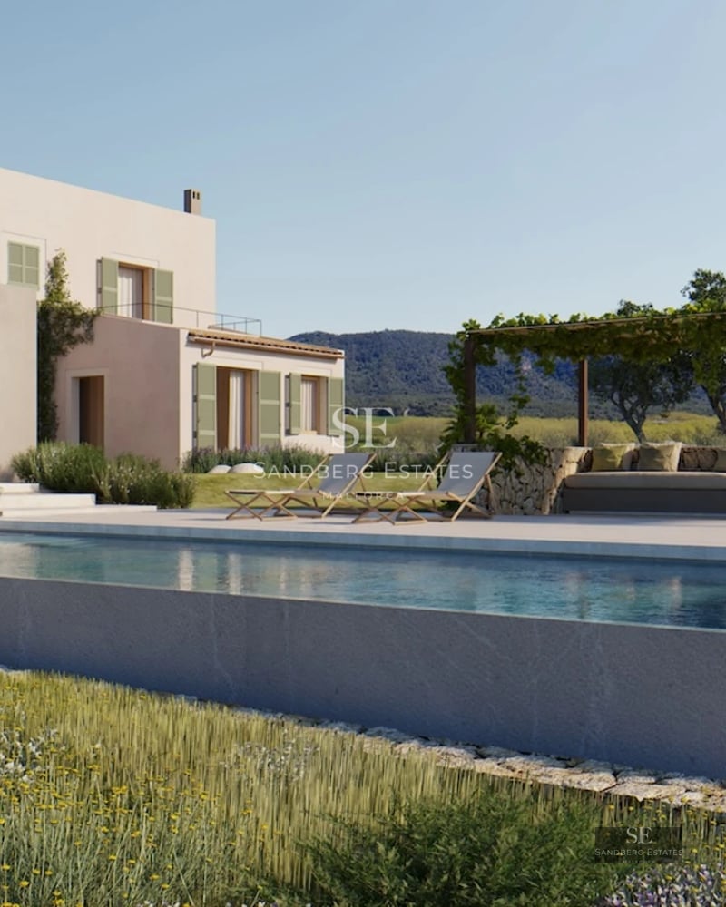 Spacious living room with window walls, gray modular sofa, fireplace, and wood floor. Modern and bright design. Exterior views.