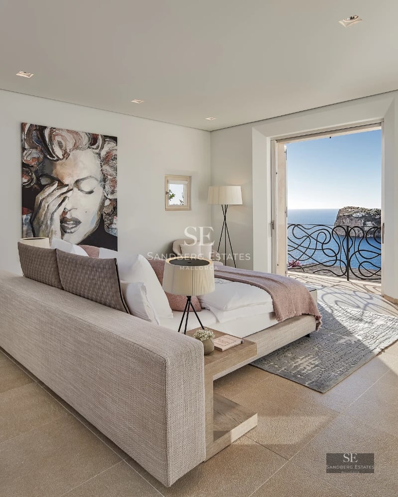 Modern exterior with reflective pool, manicured garden, and large windows offering brightness and panoramic views.