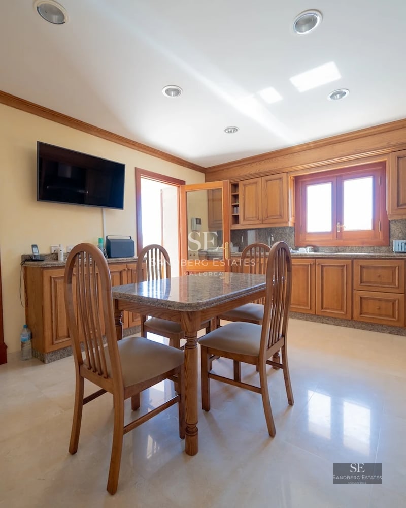 Exterior view of a modern home with pool, lush garden, and large windows. Contemporary and elegant design.