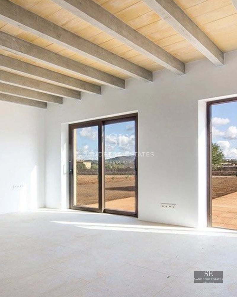 Exterior view of a modern villa with an infinity pool, large garden, and terrace with panoramic sea views. Minimalist architecture.