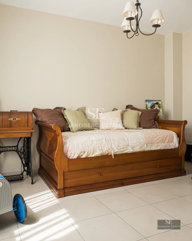 View of an elegant villa with infinity pool, lush garden, and spacious terraces. Modern architecture with large windows.