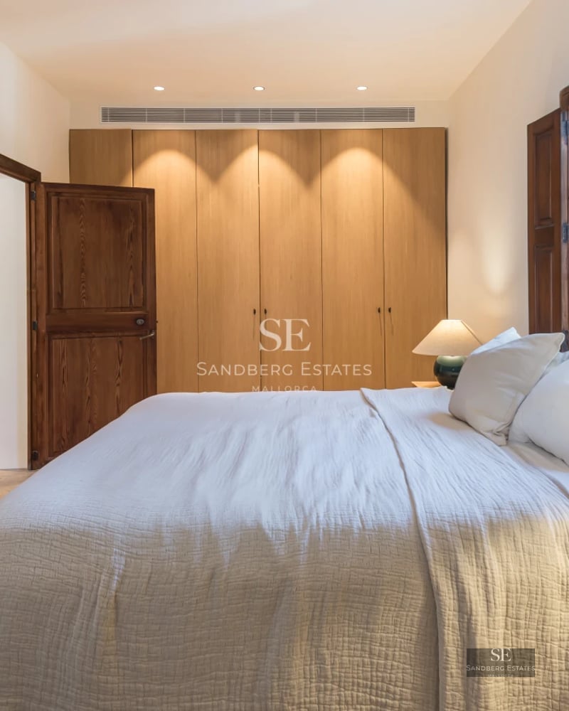 Modern interior with balcony and panoramic sea views. Stylish furniture, natural light, and minimalist design.