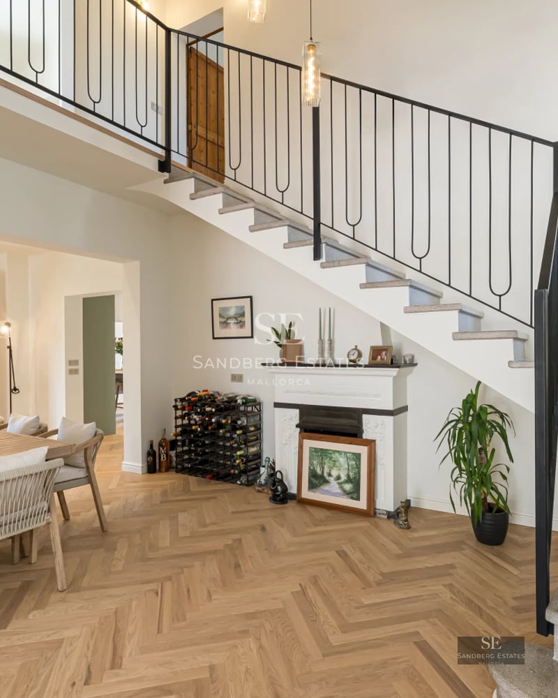 Modern facade with large windows, reflective pool, and lush garden. Minimalist architecture with natural stone accents.