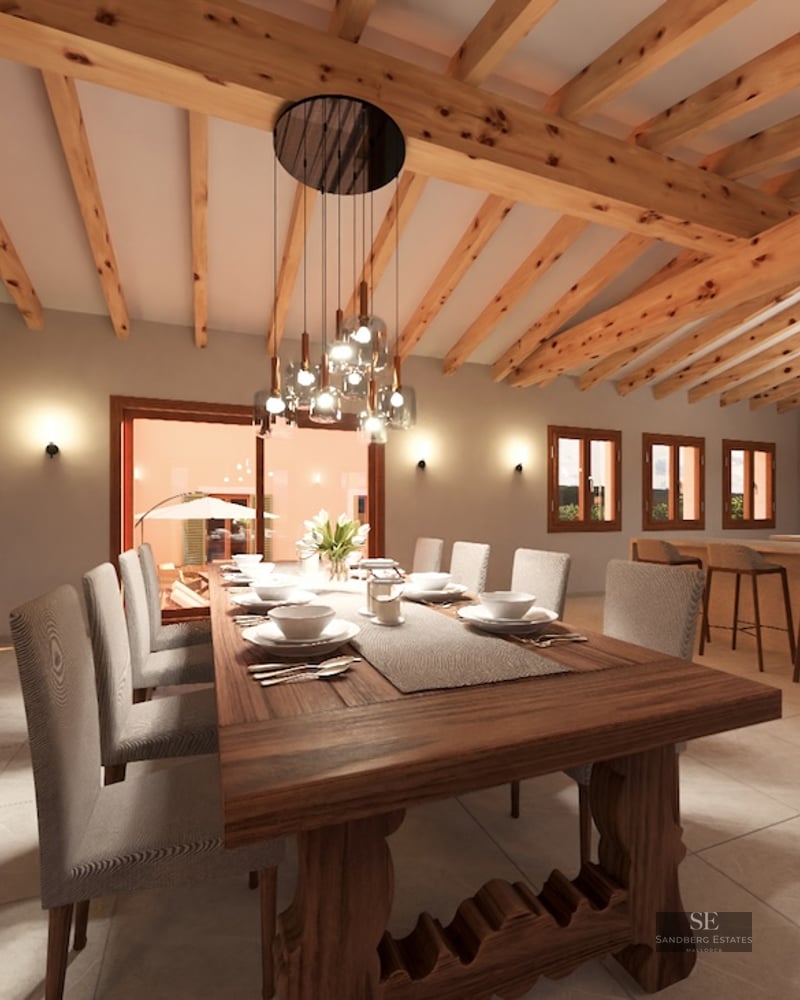 Spacious dining room featuring a massive wooden table, large stone fireplace, and exposed timber ceiling beams.