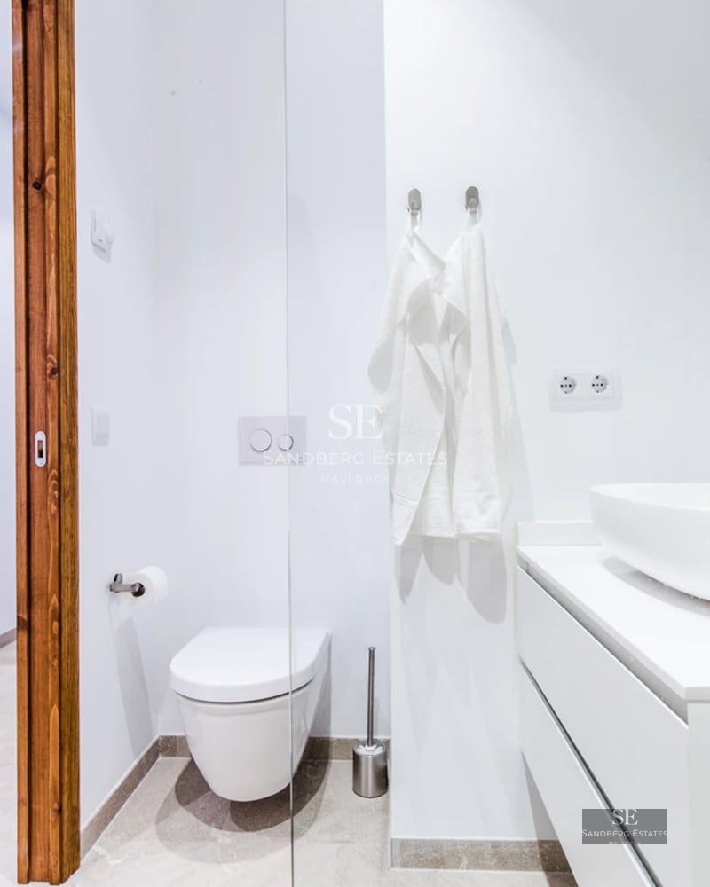 Pool view, manicured lawn, modern architecture with large windows, ambient lighting. Luxurious exterior design.