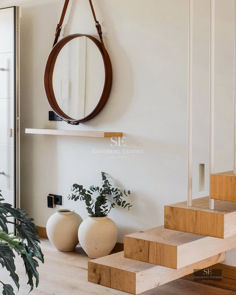 Exterior view of a modern villa featuring an infinity pool, spacious garden, and minimalist architectural design.