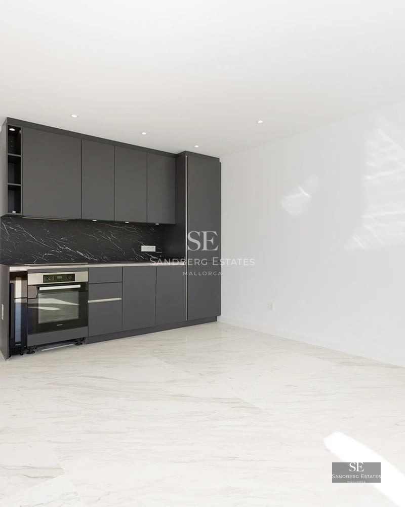 Exterior view of modern villa featuring a pool, garden, and natural stone facade. Large windows reflecting sunlight.