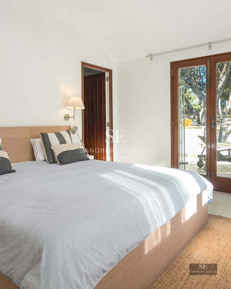 Exterior view of a luxurious villa with pool, terrace, and garden. Modern design and large windows.