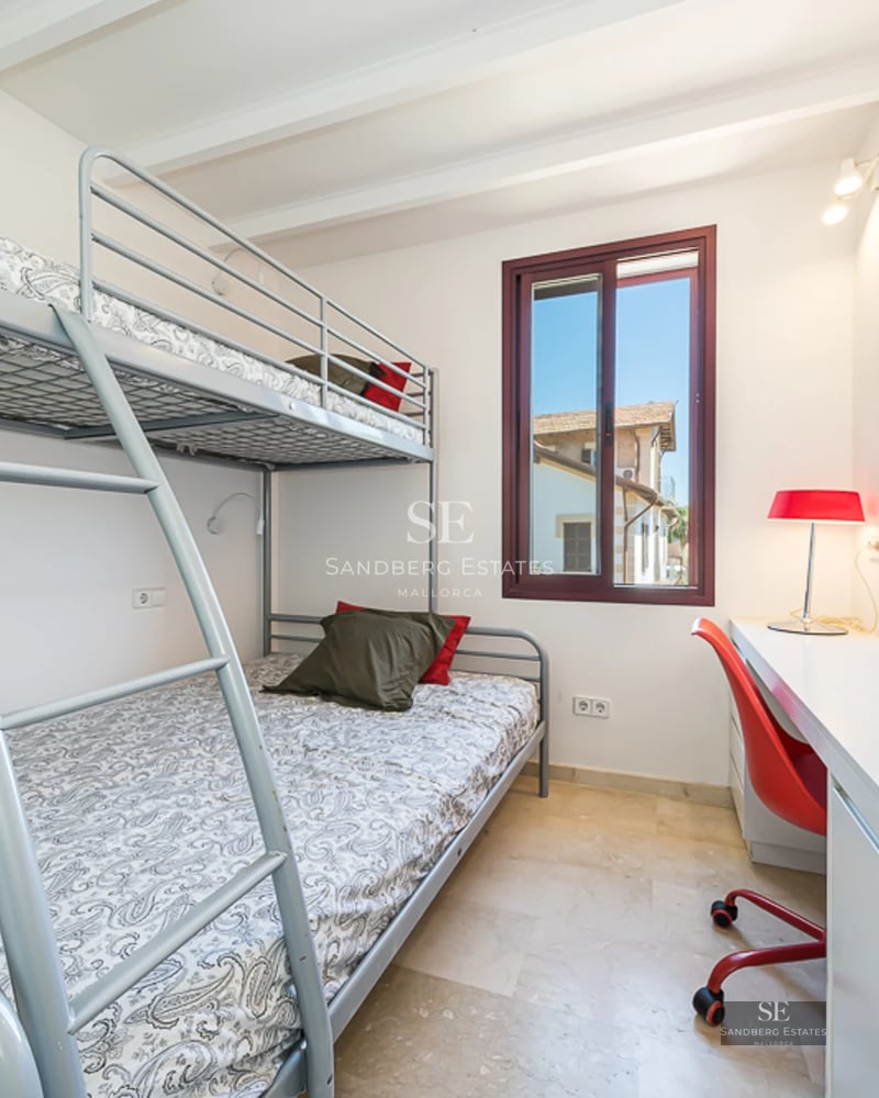 Spacious terrace with infinity pool, sun loungers and panoramic views. Modern design with wooden flooring and glass railing.