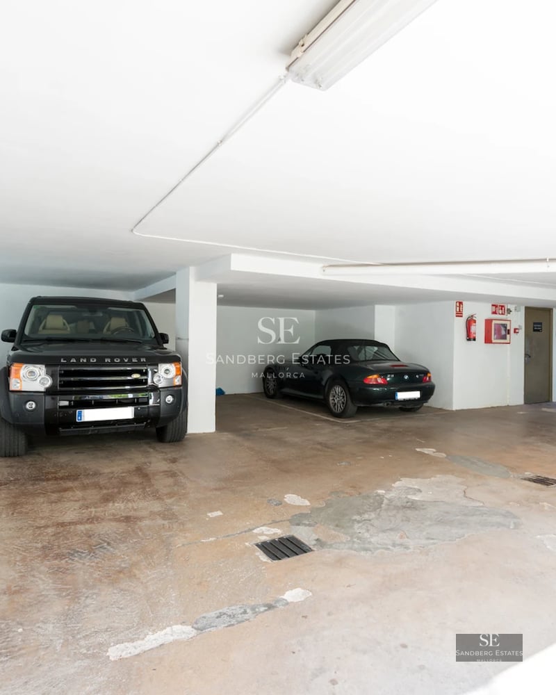Exterior view of a modern villa with a swimming pool. Sleek design, large windows, and manicured landscaping.