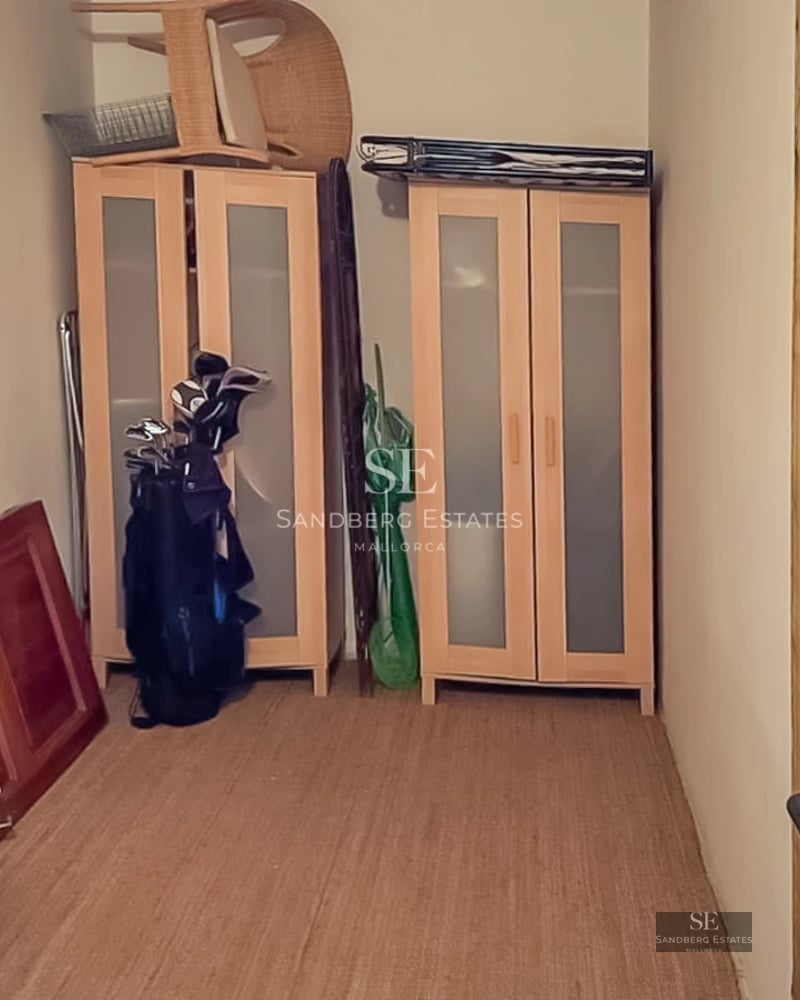 View of modern infinity pool surrounded by lush greenery. Sleek and minimalist design. Soft ambient lighting enhances the space.