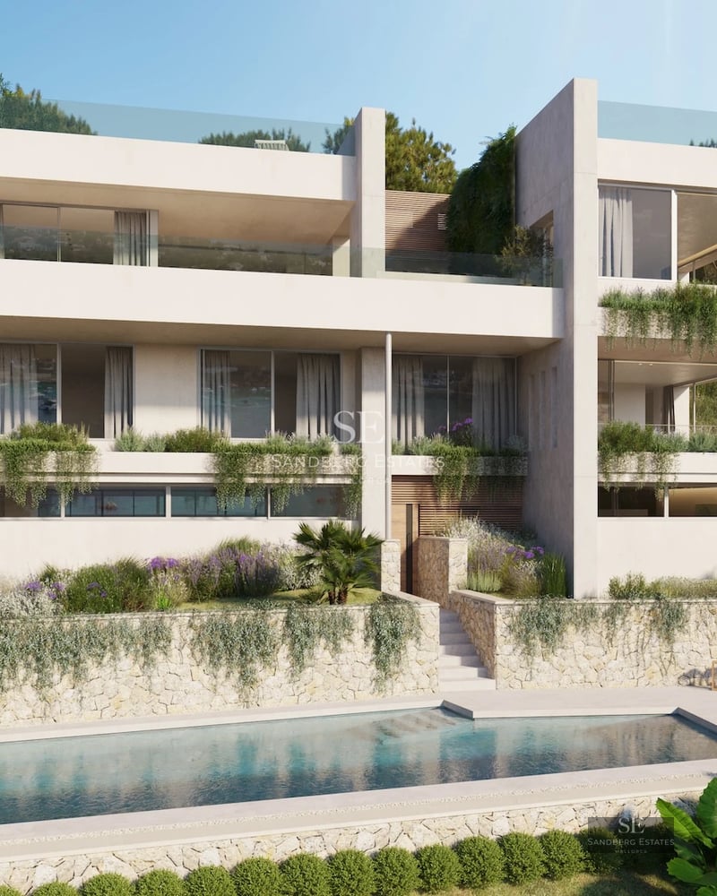 Spacious, bright living room with large windows, light wood flooring and minimalist design. Modern sofa and view of the pool and garden.