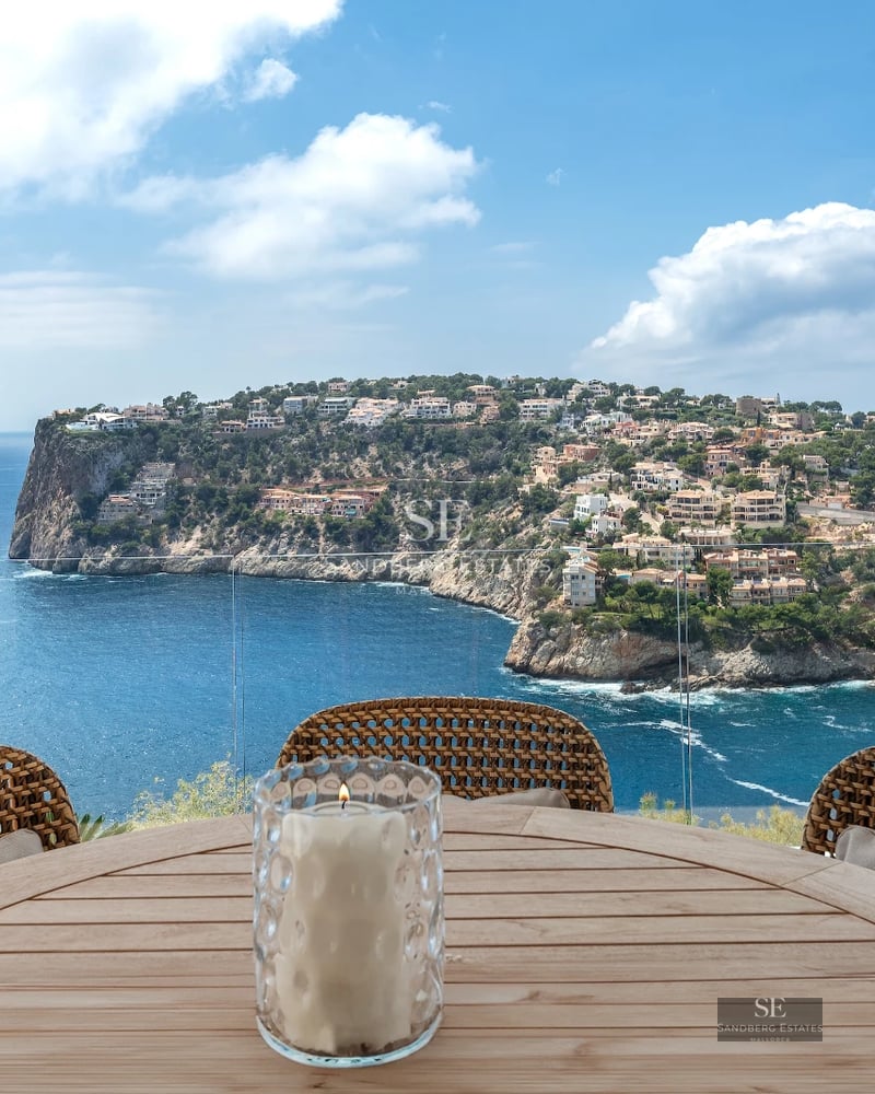 Exterior view of a modern villa with a pool, landscaped garden, and spacious terraces. Contemporary architecture featuring clean lines and large windows.
