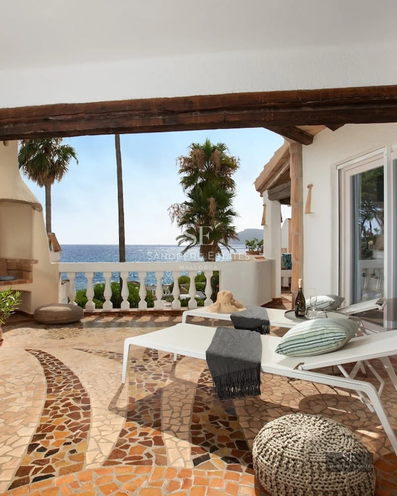 Spacious balcony with infinity pool and panoramic sea views. Modern design, elegant outdoor furniture.