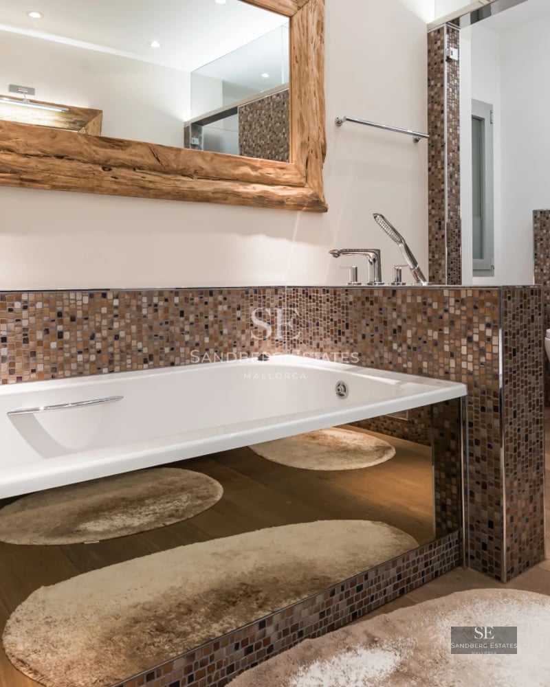 Aerial view of modern villa with pool, lush garden, and avant-garde architectural design. Natural light and high-quality finishes.