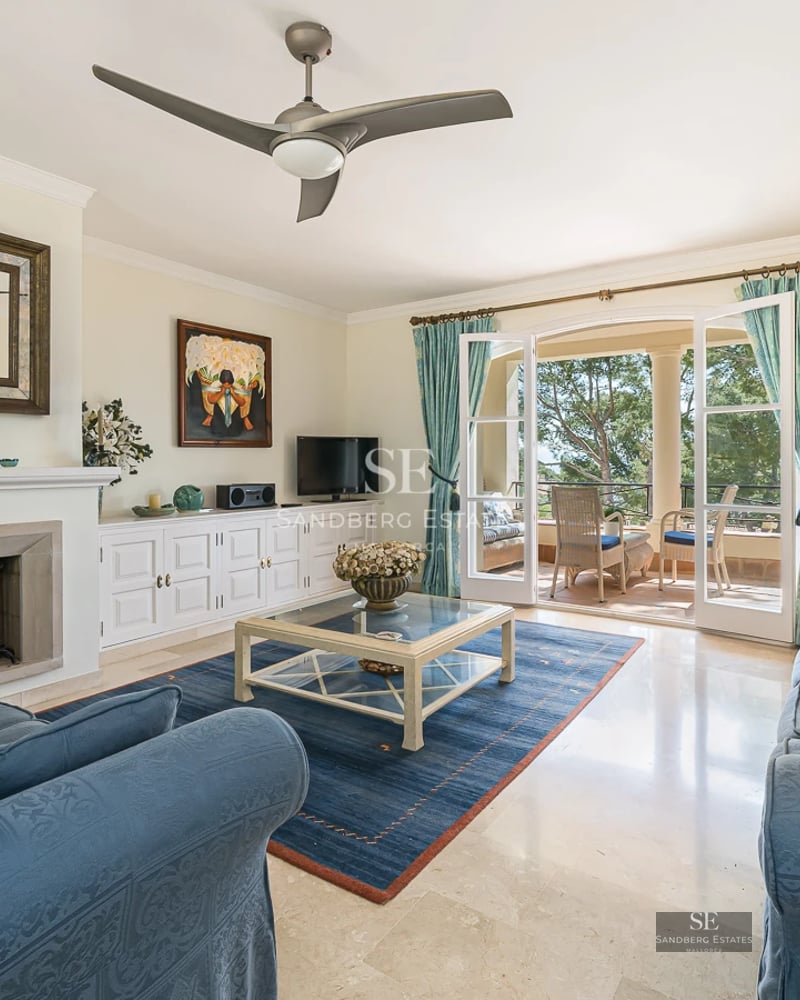 Terrace with infinity pool and sea views. Modern design with sun loungers and seating areas. Luxurious and relaxing outdoor space.