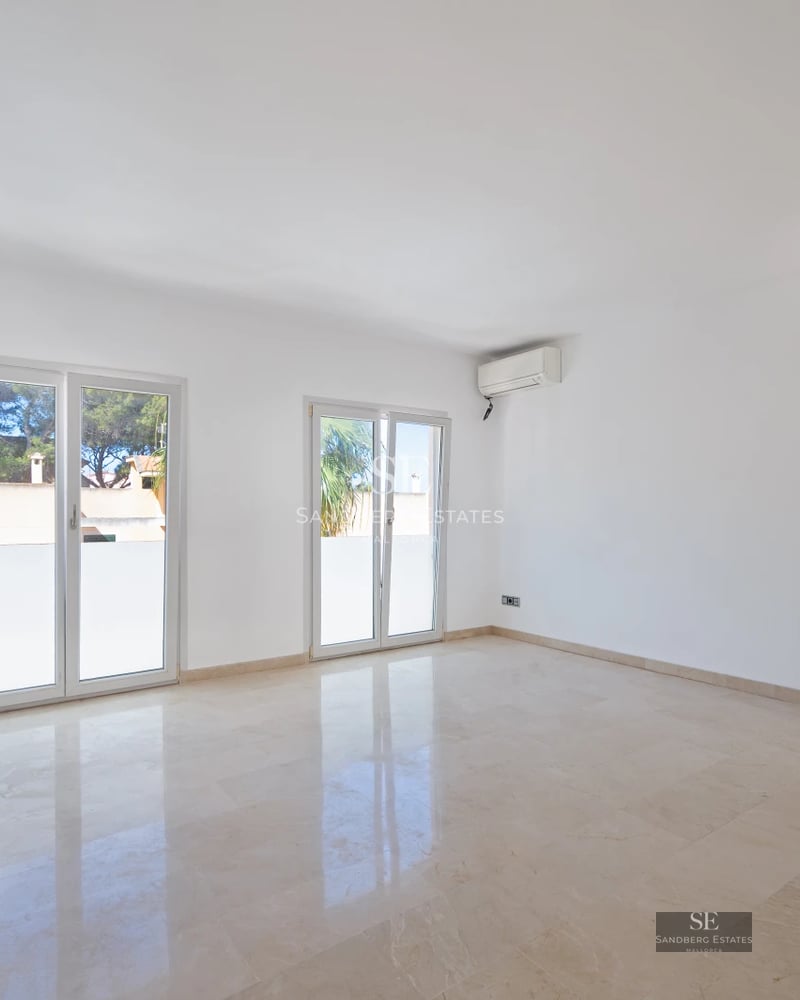 Spacious terrace featuring a pool, sun loungers, and panoramic views. Modern design with light flooring and glass railing.