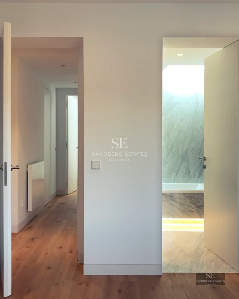 Exterior view of a luxurious villa with a pool, lush garden, and modern architectural design. Warm lighting and high-quality finishes.