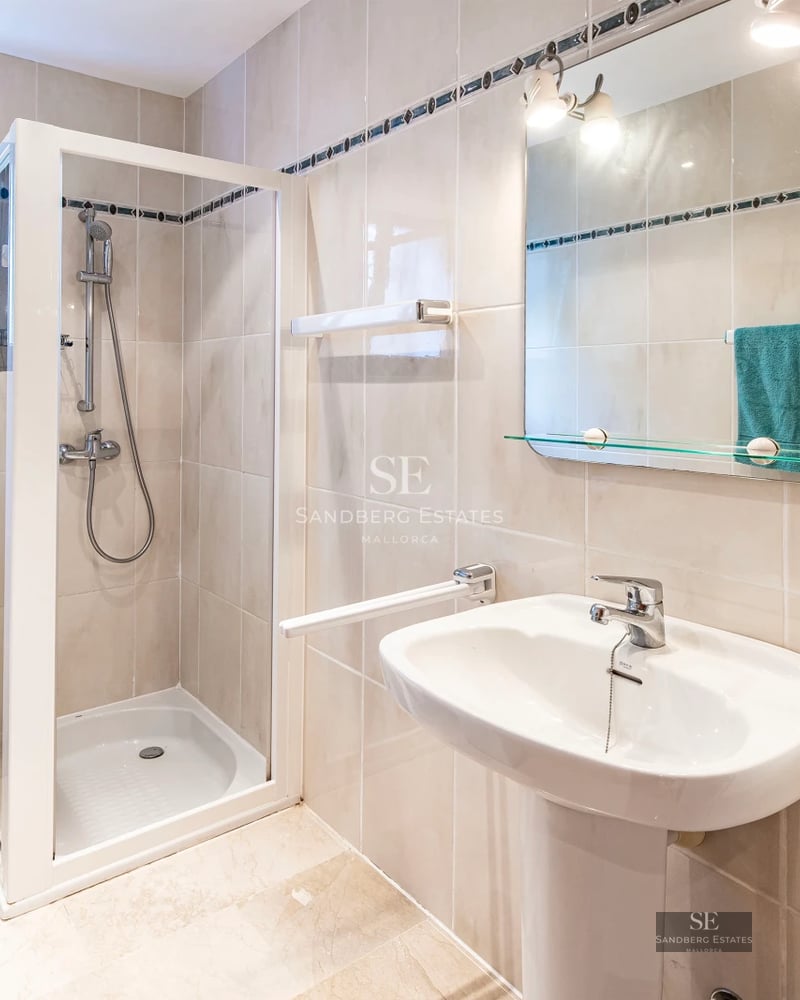 Expansive terrace with infinity pool and panoramic views. Modern design with loungers and lush greenery.