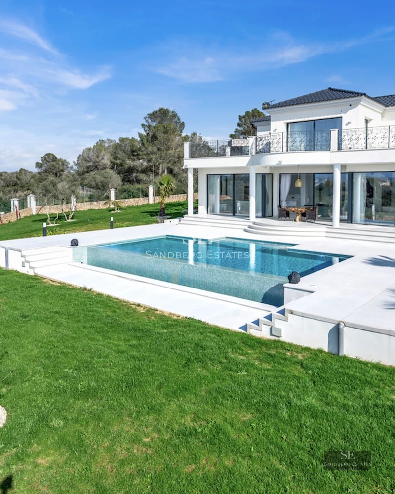 Expansive terrace featuring an infinity pool and panoramic views. Modern design, elegant furniture, and abundant natural light.