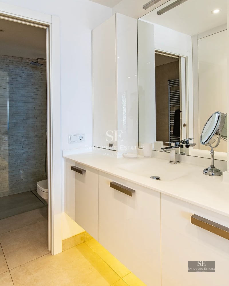 Modern penthouse with glass-enclosed terrace, infinity pool, and sea views. Minimalist design with high-end finishes.