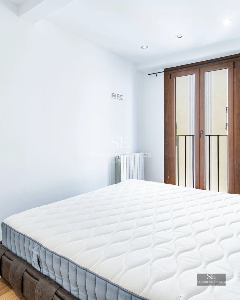 View of a modern villa with pool, sun loungers, outdoor living area, and lush gardens. Contemporary and luxurious design.