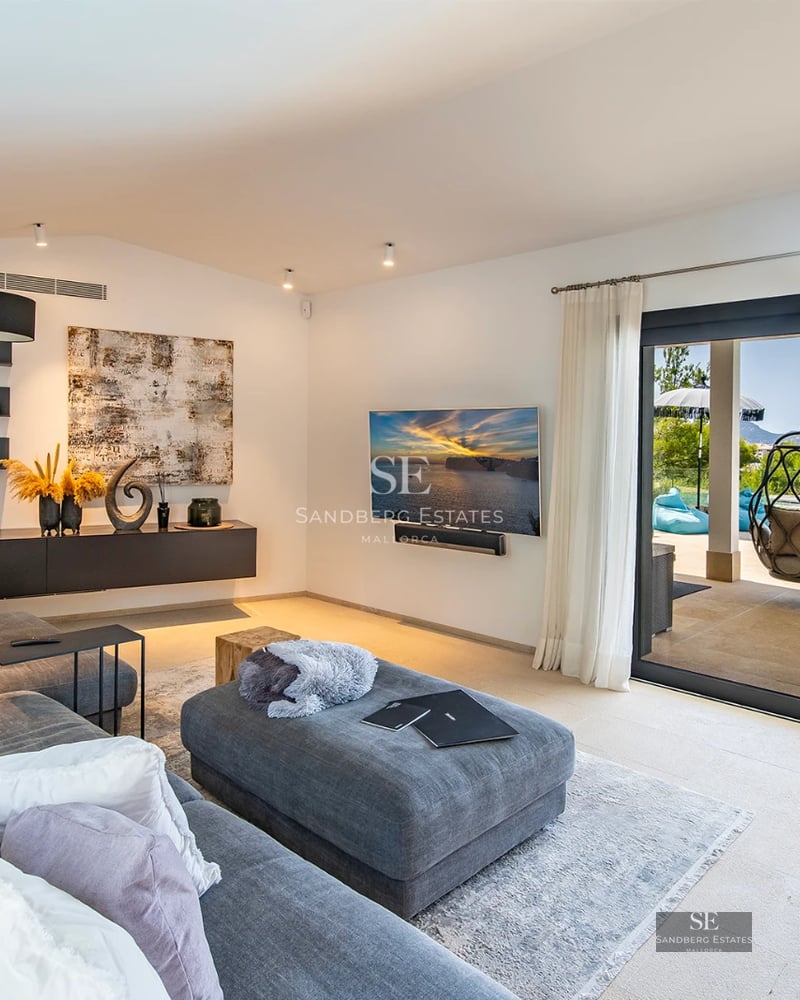 Exterior view of modern villa with infinity pool, lush garden, and spacious terraces. Minimalist design and high-end finishes.