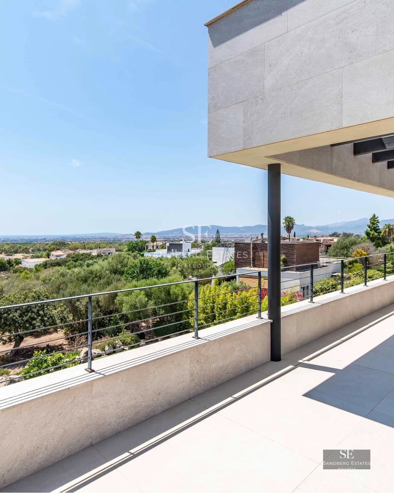 Exterior view of a modern villa with pool, terrace, and garden. Minimalist architecture featuring large windows and elegant design.
