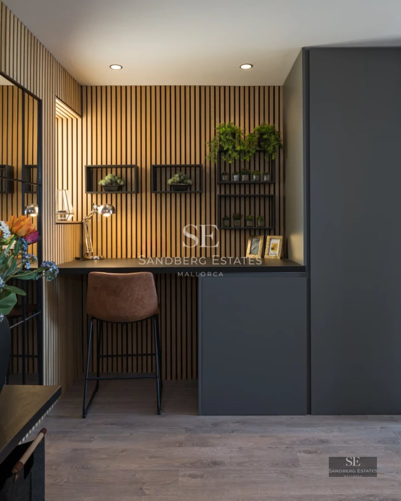 Spacious balcony with panoramic sea view. Elegant outdoor furniture and glass railing.