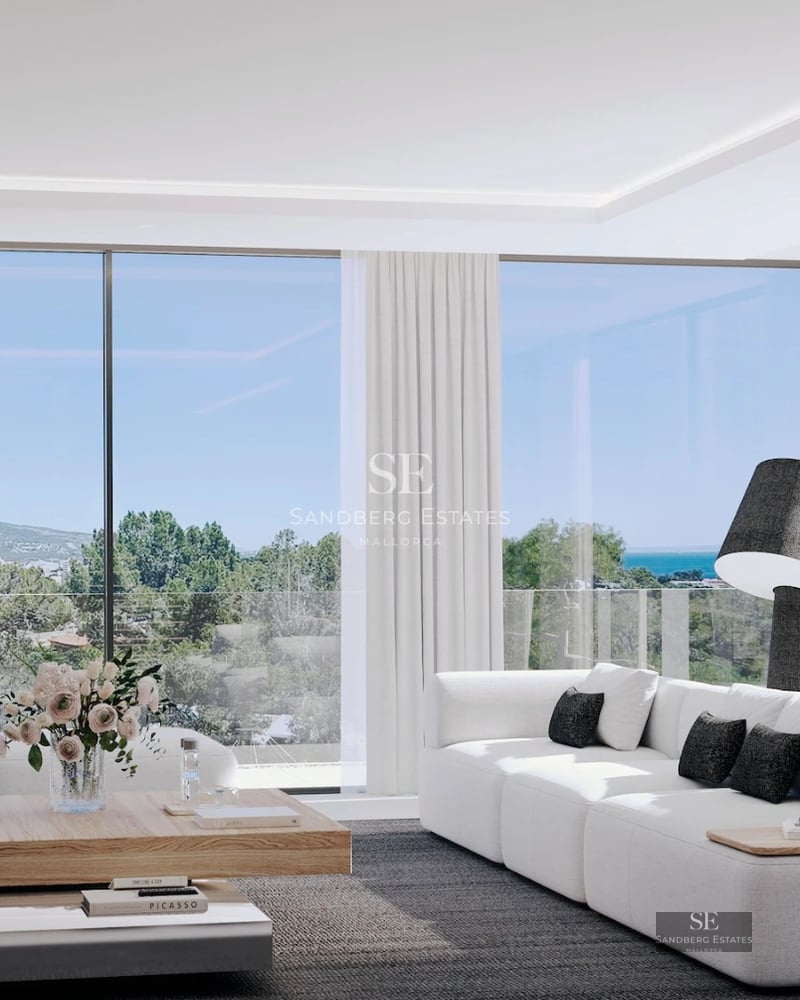 Spacious living room with fireplace, floor-to-ceiling windows, and panoramic views. Modern and elegant interior design.