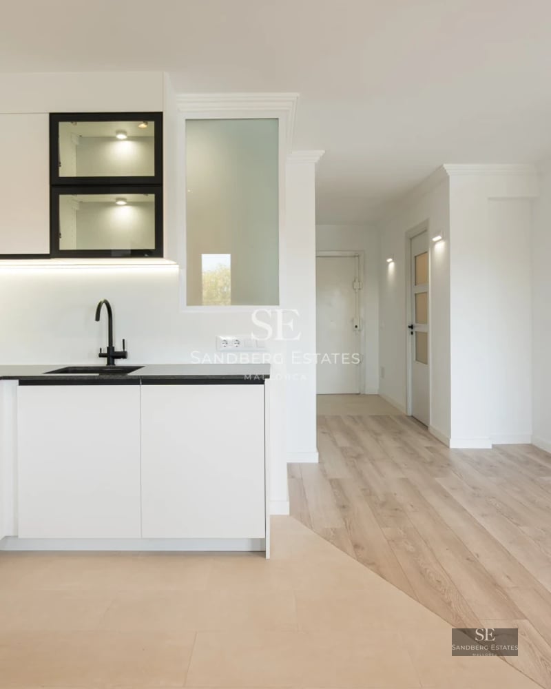 View of a modern pool with sundeck overlooking a lush garden. Minimalist architecture with large windows.