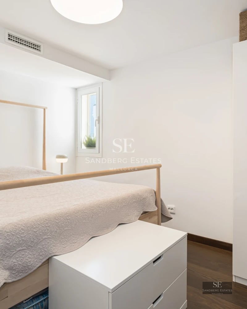 Exterior view of a modern villa featuring a pool, lush garden, and minimalist architecture. Large windows and sleek design.