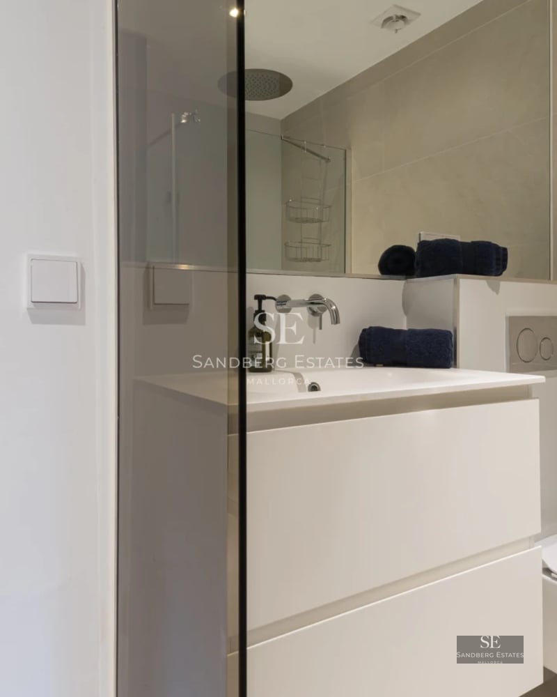 Exterior view of a modern villa featuring a swimming pool, garden, and minimalist architecture. Large windows and natural light.