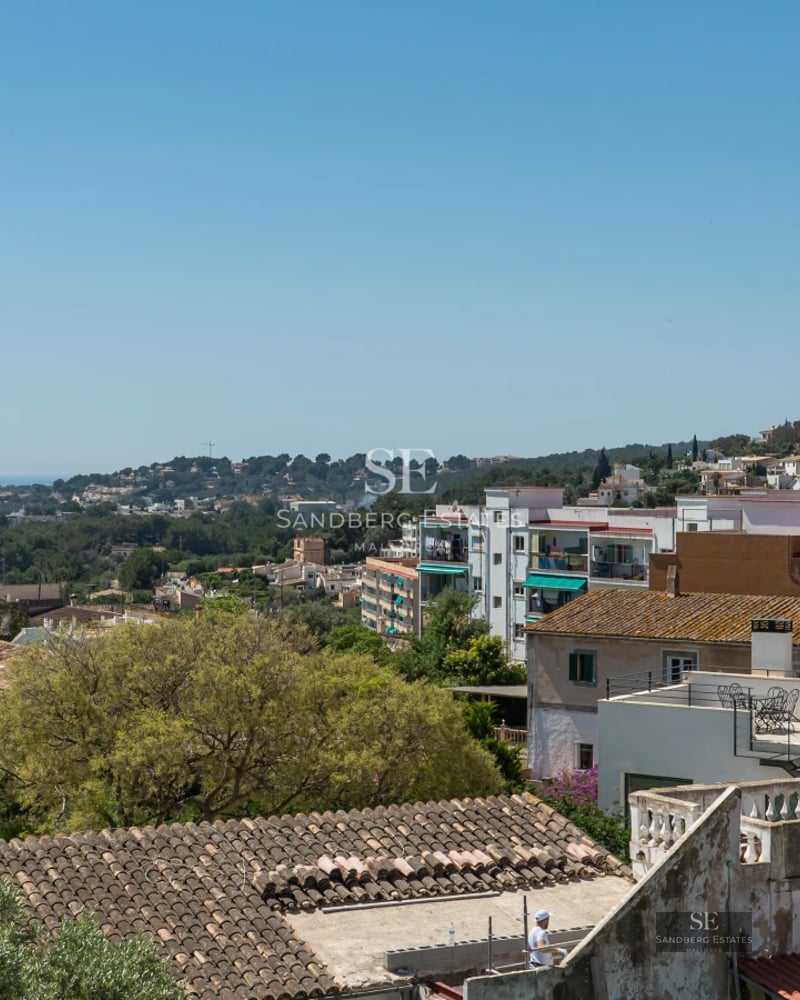 Image of villa with infinity pool, modern sun loungers, and panoramic sea views. Minimalist architecture with large windows.
