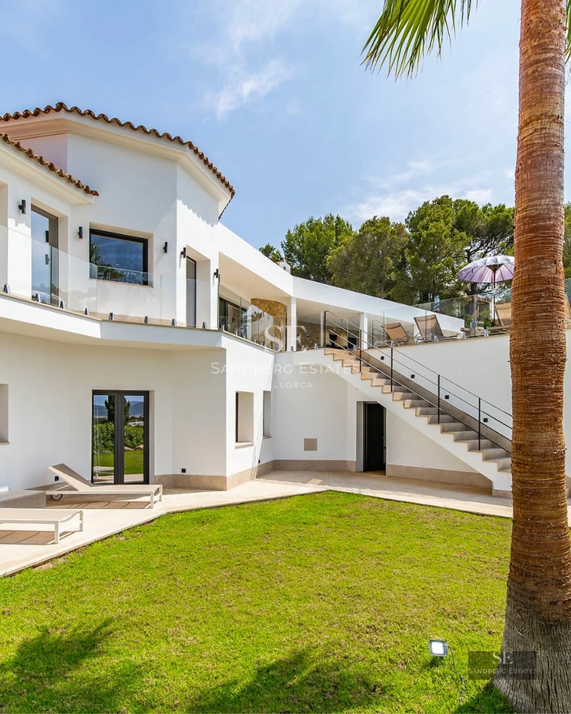 Exterior view of a modern villa with pool, lush garden and spacious living areas. Minimalist architecture with high-end finishes.