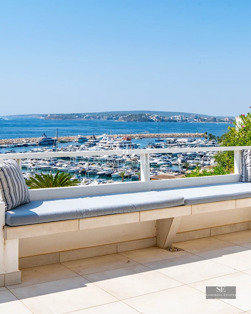 Exterior of modern villa with reflective pool, lush garden, and large windows. Minimalist architectural design.