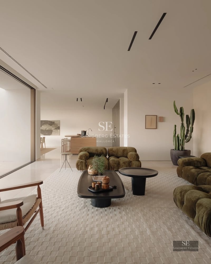 Exterior of modern villa featuring infinity pool, expansive terraces, ocean views, and contemporary architectural design.