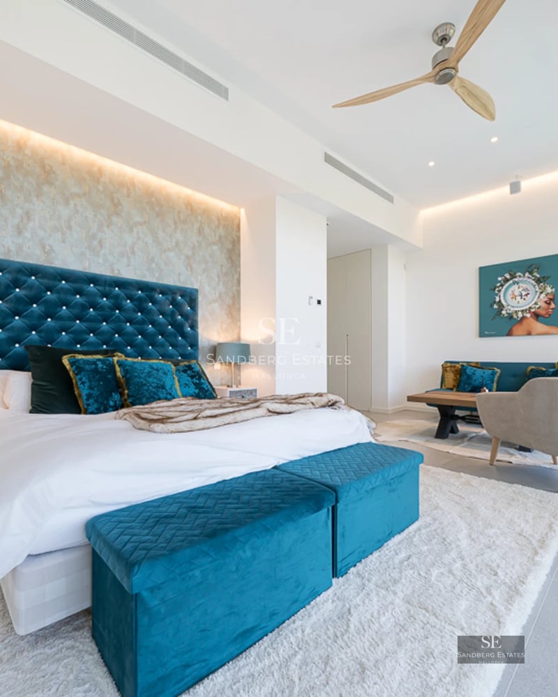 Pool and garden view. Modern architecture with large windows. Warm ambient lighting. Luxurious outdoor space.