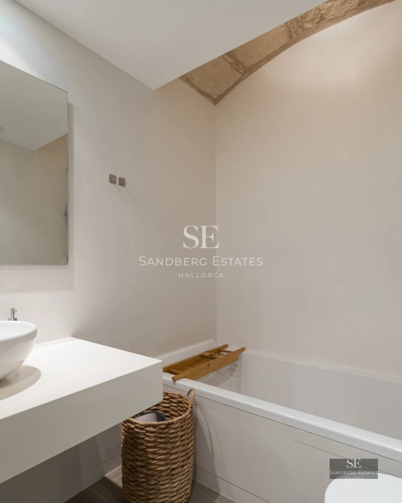 Bright living room featuring expansive windows, light wood floors, and modern design. Panoramic sea views and large balcony.